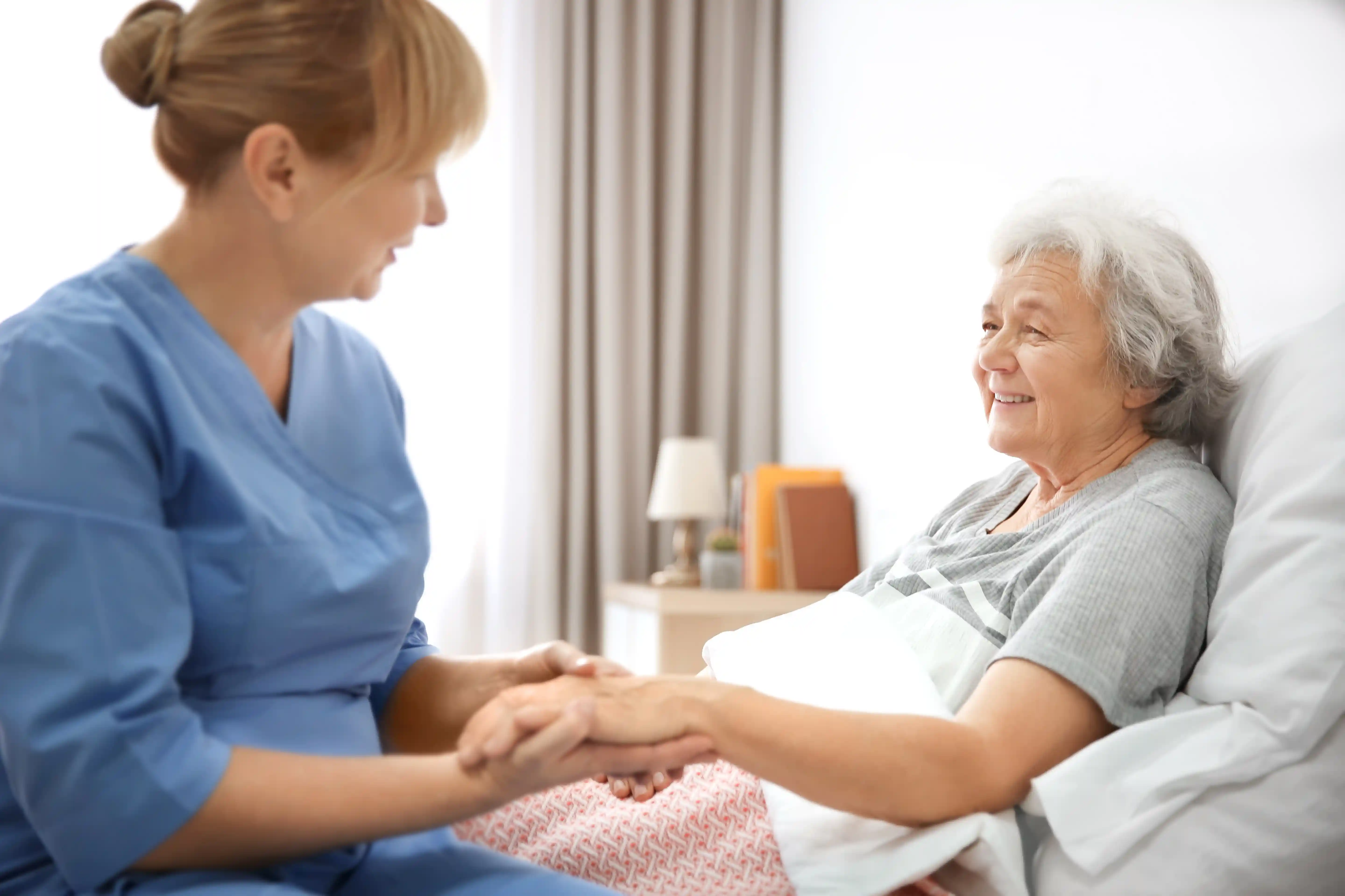 RN lead caregiver providing personalized senior care at Joani Twin Lakes Adult Family Home